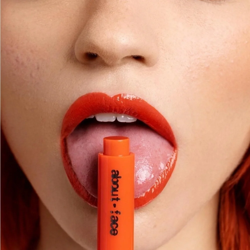 ABOUT FACE NIB CHERRY PICK LIP BUTTER IN ORANGE DAZE